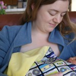 mom and baby, in a blankie from Aunt Christine