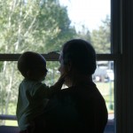 Grandpa and T look out the window